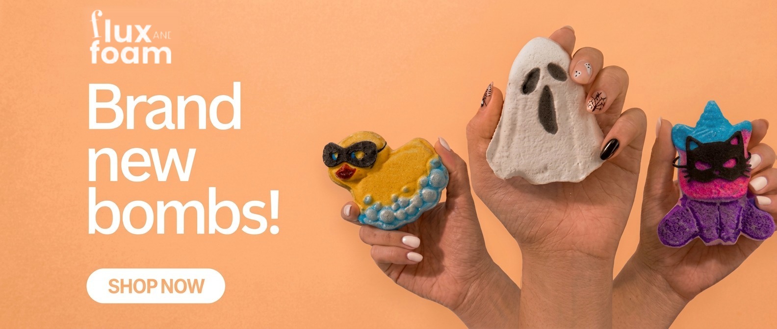 Brand new bombs — duck, ghost and cat bath bombs held up in two hands